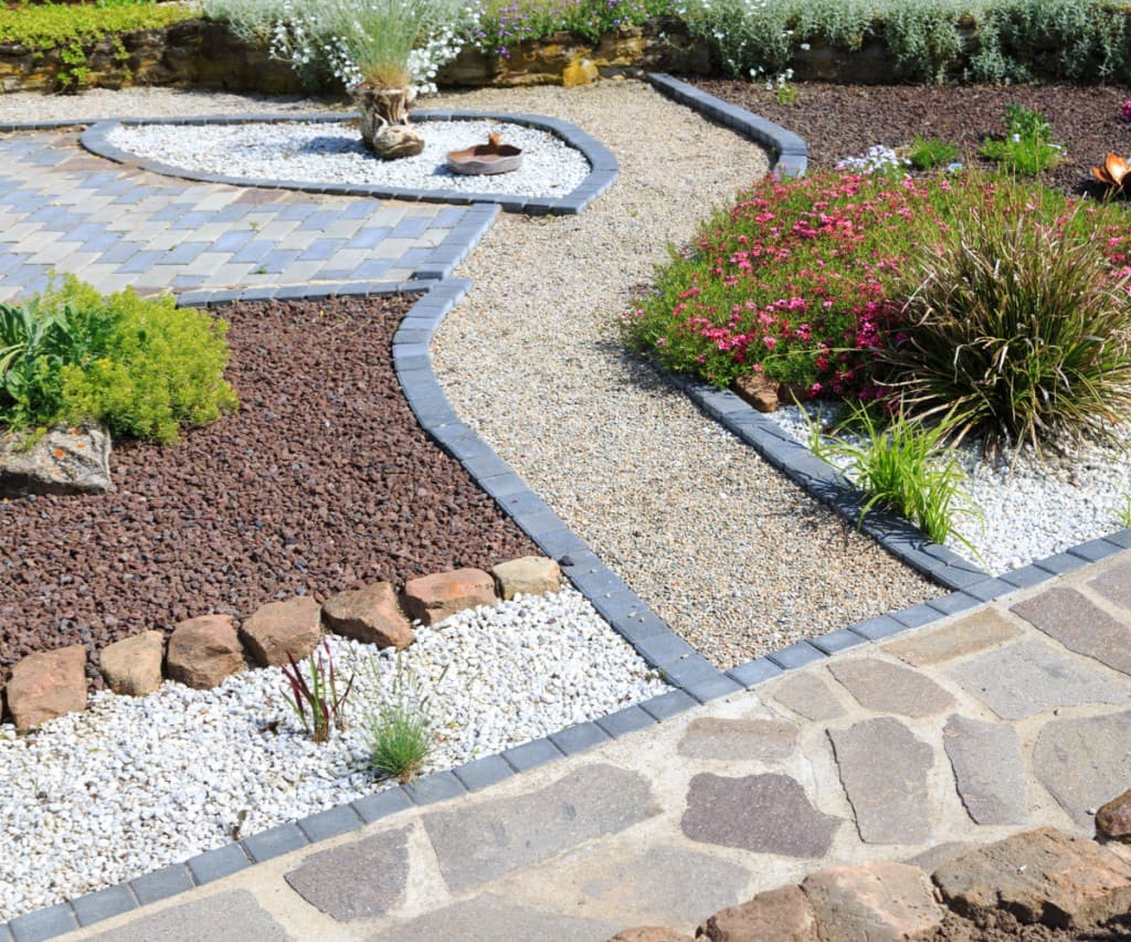 Professional home garden landscaping with stone paths and plants